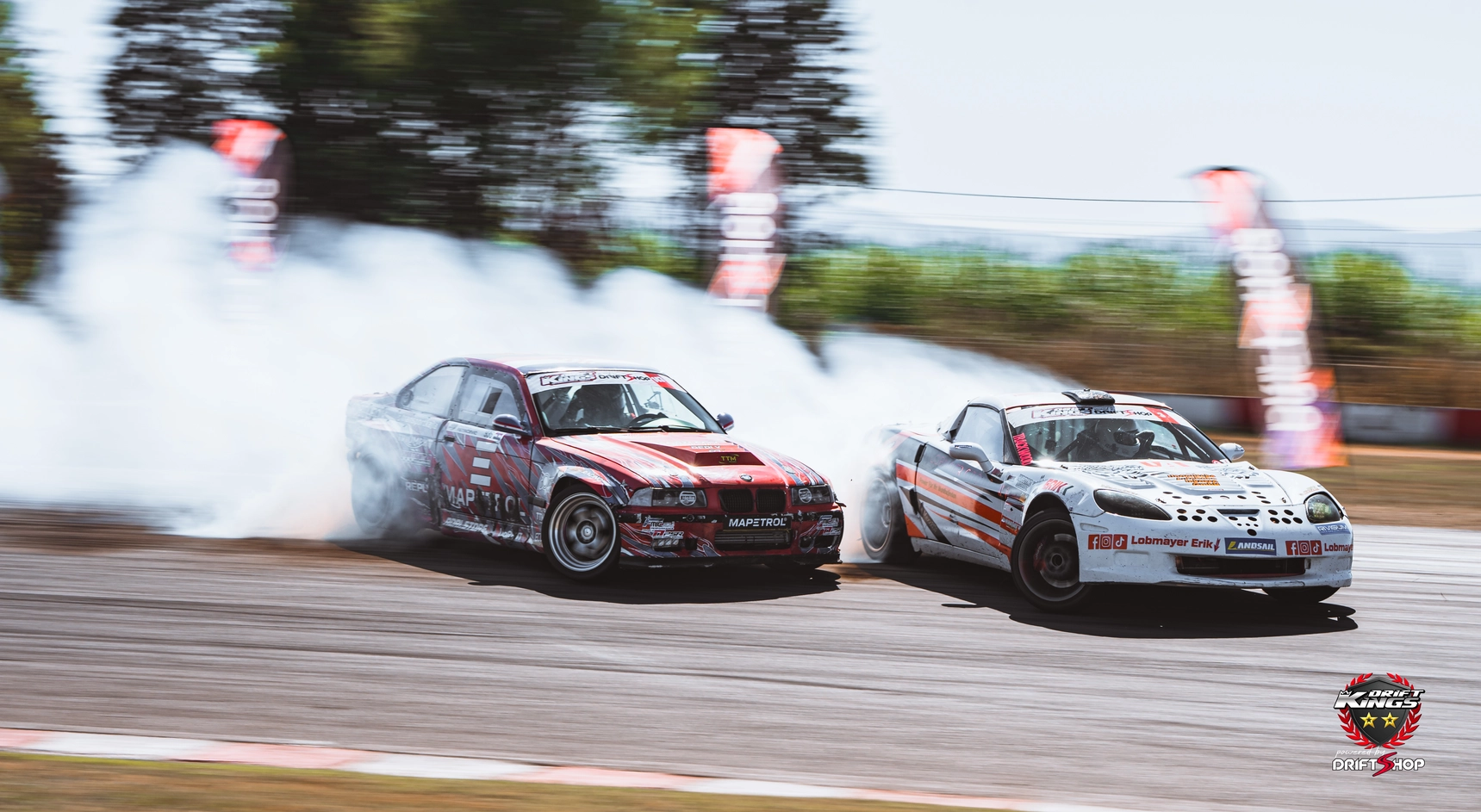 Erik Lobmayer’s white Corvette in tandem action with a red BMW at Serres